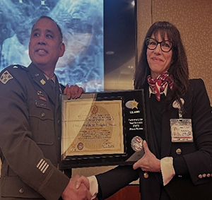 LTC Luna and Ms. Price with the display plaque 